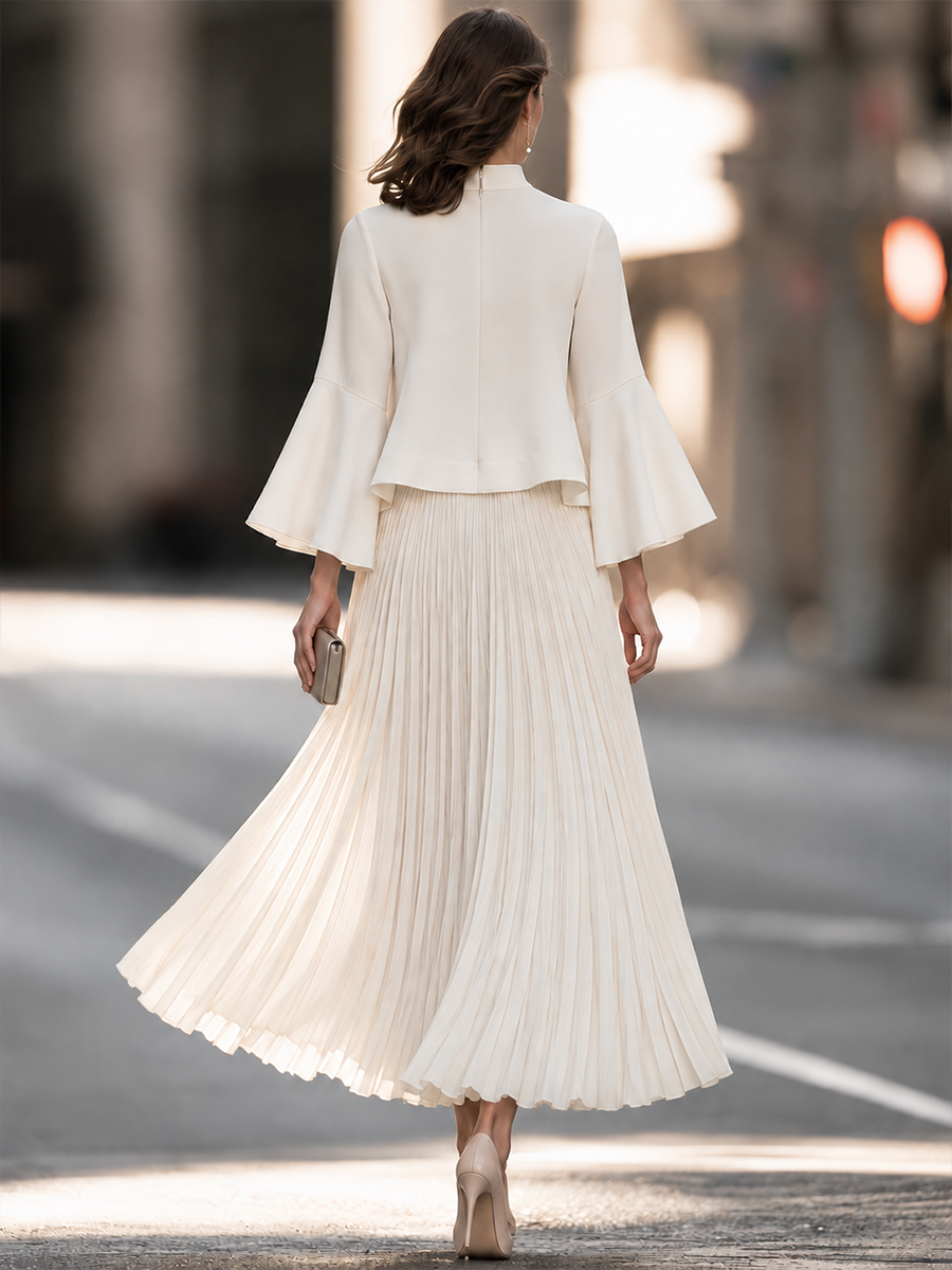 Mock Neck Dress With Bell Sleeves And Pleated Skirt