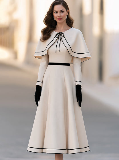Two-piece Set Featuring An Ivory-white Cape With Black Piping And An A-line Midi Skirt