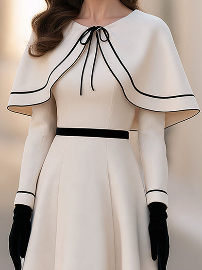 Two-piece Set Featuring An Ivory-white Cape With Black Piping And An A-line Midi Skirt