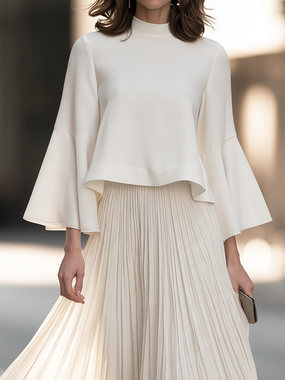Mock Neck Dress With Bell Sleeves And Pleated Skirt