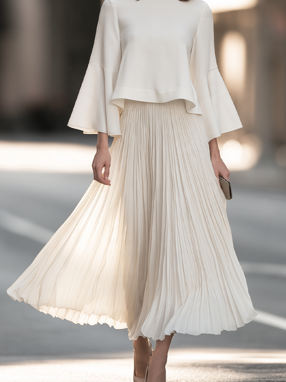 Mock Neck Dress With Bell Sleeves And Pleated Skirt