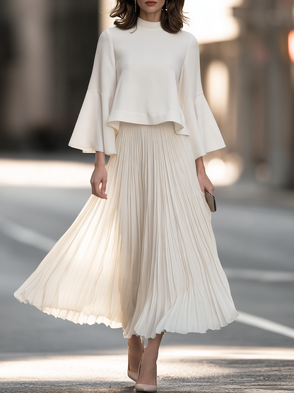 Mock Neck Dress With Bell Sleeves And Pleated Skirt